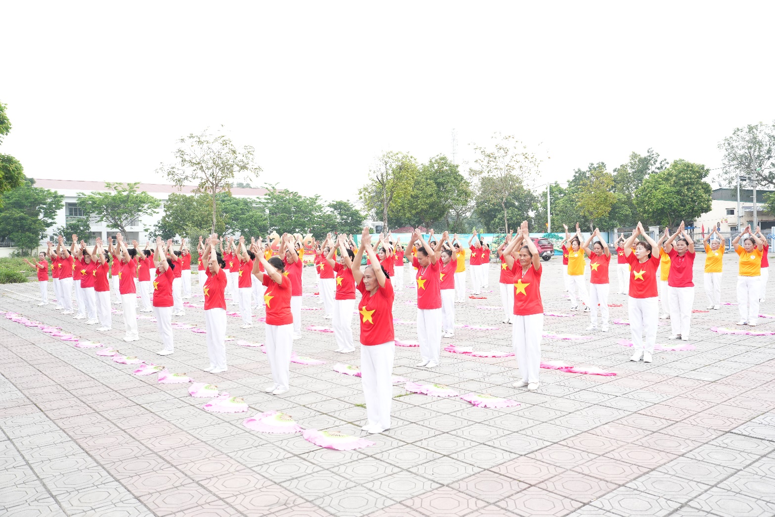 A group of people in red shirts  AI-generated content may be incorrect.