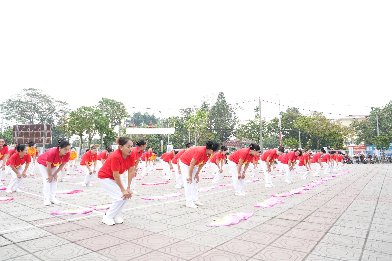 A group of people in red shirts  AI-generated content may be incorrect.