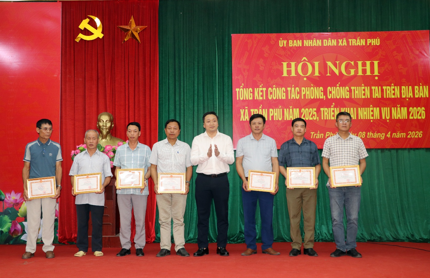 A group of men standing on a stage holding certificates  AI-generated content may be incorrect.