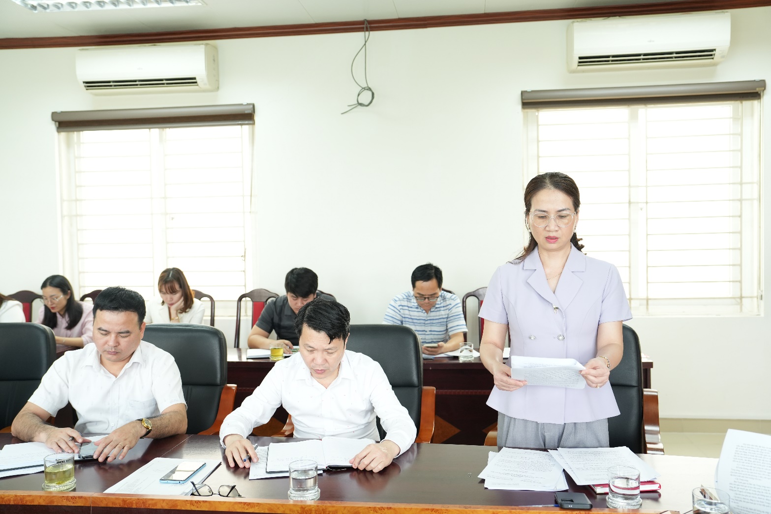 A group of people in a meeting  AI-generated content may be incorrect.