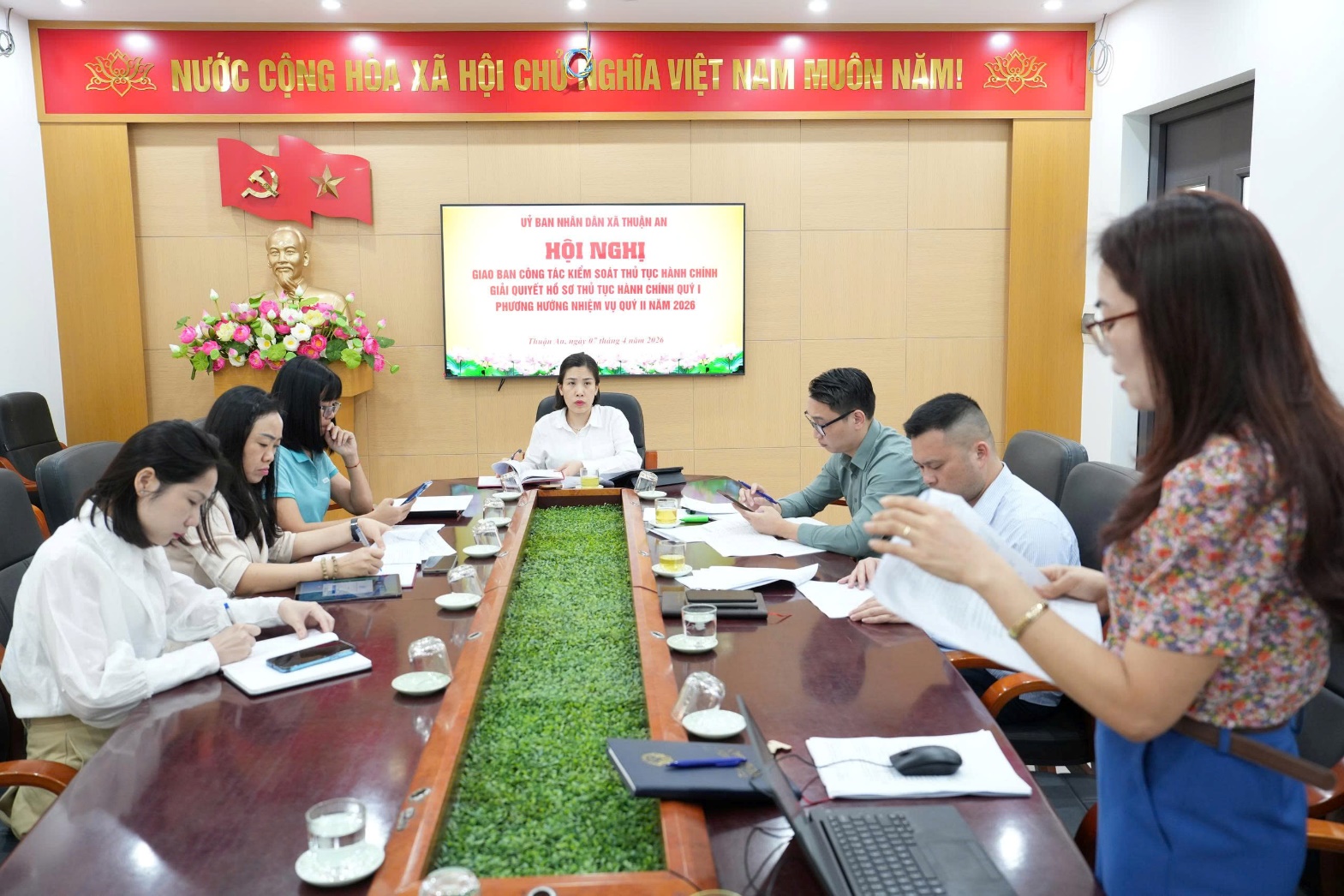 A group of people sitting around a long table  AI-generated content may be incorrect.