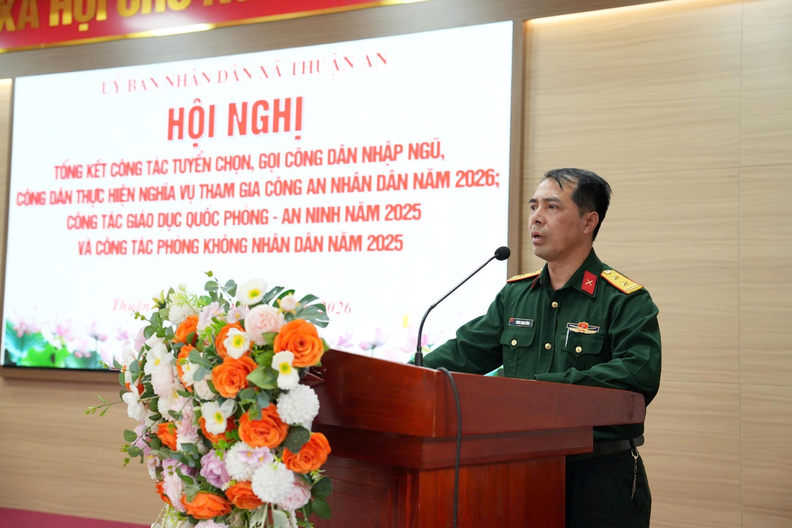 A person in uniform standing at a podium  AI-generated content may be incorrect.