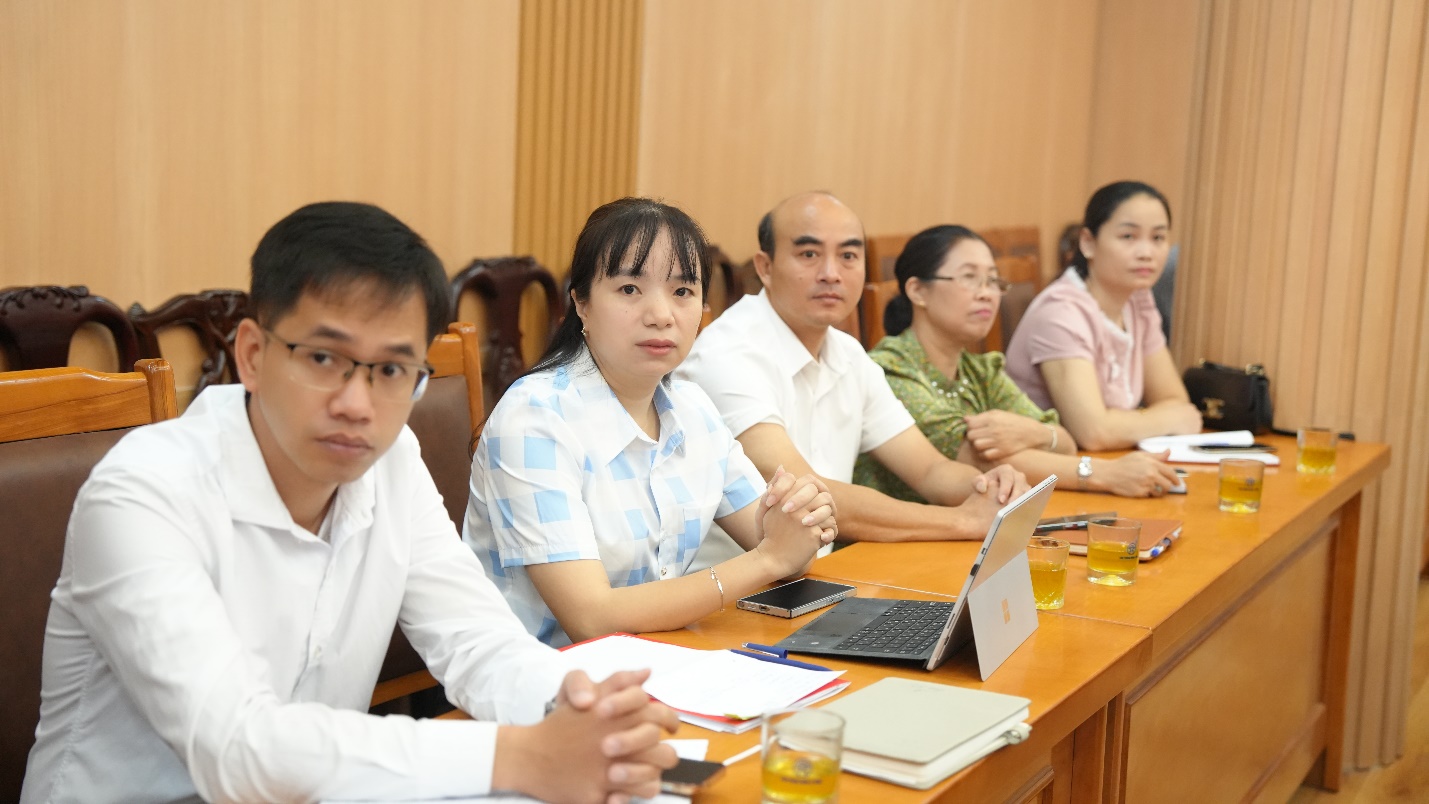 A group of people sitting at a table  AI-generated content may be incorrect.