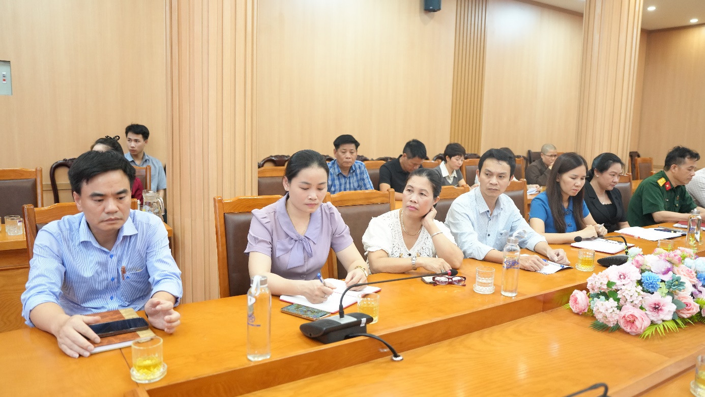 A group of people sitting at a table  AI-generated content may be incorrect.