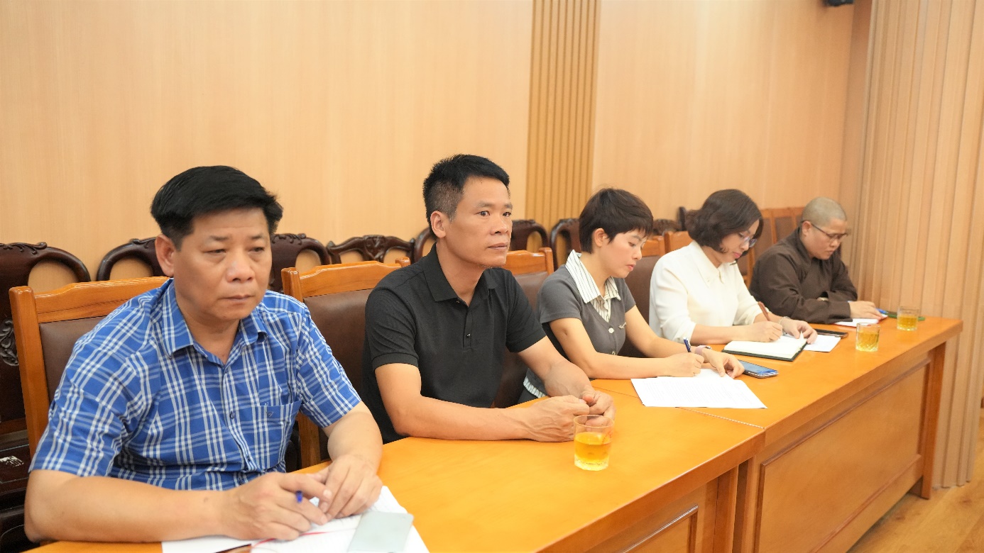 A group of people sitting at a table  AI-generated content may be incorrect.