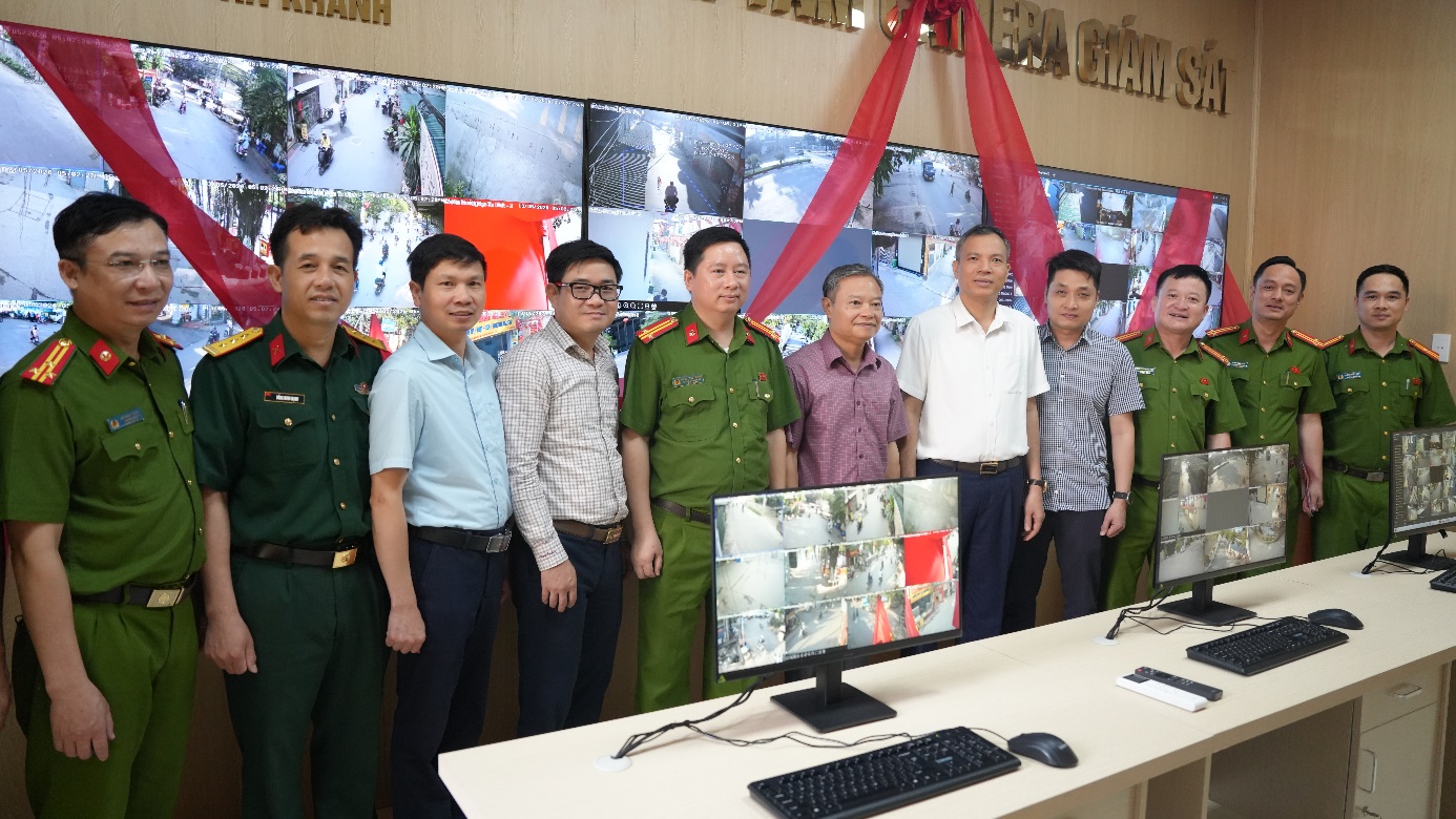 A group of men standing in front of a computer  AI-generated content may be incorrect.