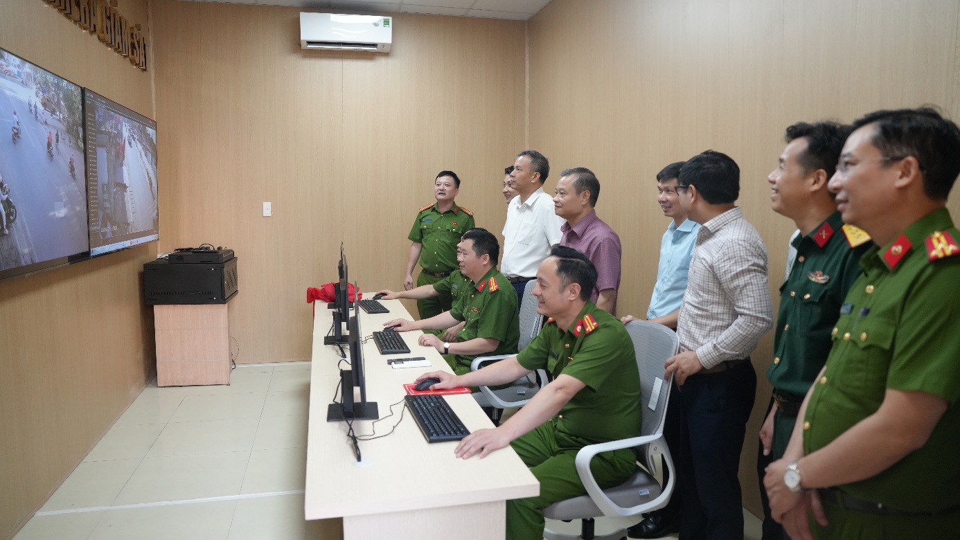 A group of men in uniform sitting at a desk with computers  AI-generated content may be incorrect.