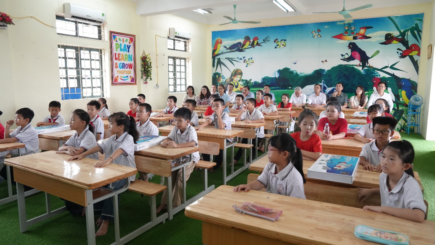 A classroom with students in front of a mural  AI-generated content may be incorrect.
