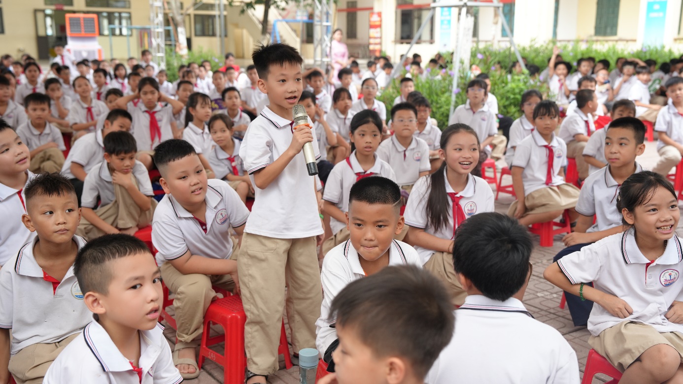 A group of children in a classroom  AI-generated content may be incorrect.