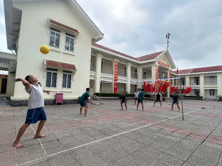 A group of people playing volleyball  AI-generated content may be incorrect.