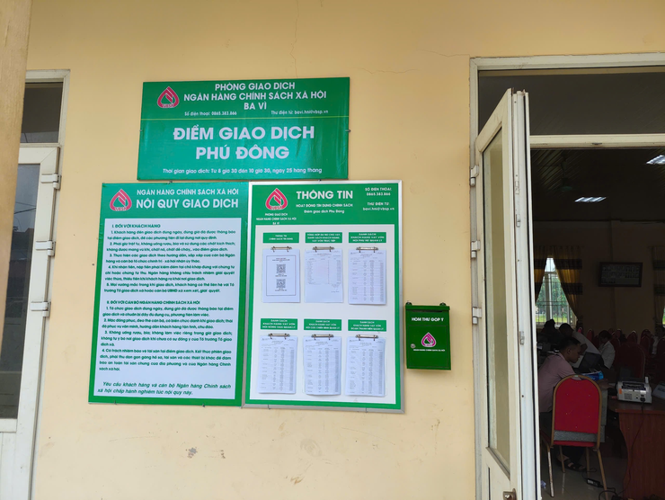 Khách vay vốn tại Ngân hàng Chính sách xã hội được giảm 2% lãi suất do ảnh hưởng của cơn bão số 12- Ảnh 1.