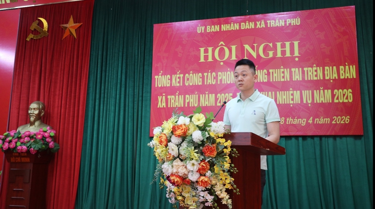 A person standing at a podium with flowers  AI-generated content may be incorrect.