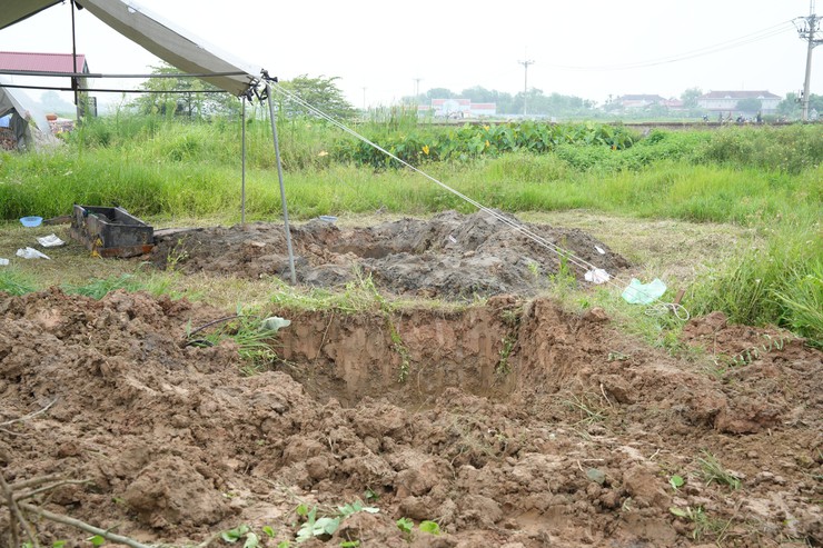 Đẩy nhanh tiến độ di chuyển mồ mả, bàn giao mặt bằng thực hiện dự án Khu đô thị thể thao Quốc tế Hà Nội- Ảnh 2.