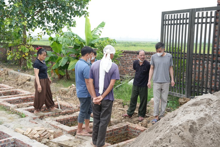 Đẩy nhanh tiến độ di chuyển mồ mả, bàn giao mặt bằng thực hiện dự án Khu đô thị thể thao Quốc tế Hà Nội- Ảnh 4.